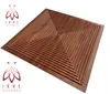 A square wooden panel with a geometric pattern of concentric squares, set against a white background. Two logos with the text 'IKHE MALARKA' are visible in the bottom left and top left corners. Produktbild-Vorschau