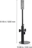 A black floor stand for a vacuum cleaner, with dimensions indicated. Voir les images du produit
