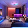 A modern living room with colorful LED lighting, a sofa, a coffee table, and a bar area. Voir les images du produit