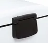 A close-up shot of a black handle on a white object, likely a trash can. Anteprima dell’immagine prodotto