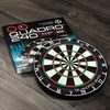 A dartboard and its packaging are placed on a wooden surface. Podgląd zdjęcia produktu