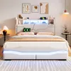 A modern white bed with LED lighting and integrated storage, set in a bedroom with abstract art on the wall. Voir les images du produit