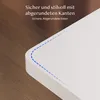 Close-up of a white desk corner with rounded edges, on a wooden floor. Anteprima dell’immagine prodotto