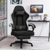 A gaming chair is shown in a room with a desk and computer. Produktbild-Vorschau