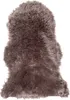 A brown faux fur rug on a white background. Produktbild-Vorschau