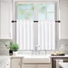 A kitchen sink area with white curtains hanging over a window. Náhled obrázku produktu