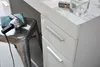 A close-up view of a white dresser with silver handles, a hairdryer on a stool, and a perfume bottle on top. Produktbild-Vorschau