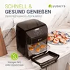 A black air fryer is shown on a kitchen counter with food inside and on a plate next to it. Text overlays describe its features. Produktbild-Vorschau