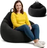 A woman is sitting on a black beanbag chair, with another black beanbag chair shown in the background. Voir les images du produit