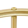 A close-up shot of a gold-colored metal connection point on a curved object, featuring a hexagonal screw. Podgląd zdjęcia produktu