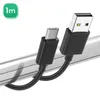 A black USB-C to USB-A charging cable is shown on a metallic track. Produktbild-Vorschau