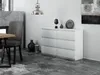 A modern living room or dining room setting with a white dresser, a gray chair, and a dining table. Náhled obrázku produktu