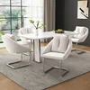 A dining room set with a marble-top table and four beige upholstered chairs. Anteprima dell’immagine prodotto