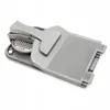 A gray plastic kitchen tool, likely a grater and fish scaler, is shown against a white background. Podgląd zdjęcia produktu