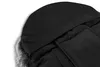 A close-up view of the hood and fur trim of a black winter footmuff. Náhled obrázku produktu