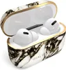 A pair of white wireless earbuds in a marble-patterned charging case with a gold trim. Produktbild-Vorschau