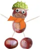 A craft figure made from chestnuts, resembling a snowman, with a hat, scarf, and googly eyes. Anteprima dell’immagine prodotto