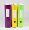 Three colorful binders standing upright against a light gray background. Voir les images du produit
