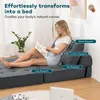 A woman is sitting on a sofa bed, reading a magazine. The sofa bed is gray and appears to be in a living room setting. Náhled obrázku produktu