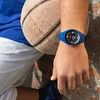 A person wearing a blue watch and holding a basketball. Produktbild-Vorschau