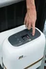 A hand is shown pressing a button on the control panel of a white whirlpool tub. Produktbild-Vorschau