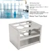 A metal test tube rack is shown in the foreground, with a blurred laboratory background. Náhľad obrázku produktu