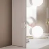 A close-up view of a vanity mirror with integrated lights. Náhled obrázku produktu