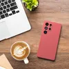A flat lay of a smartphone case, a laptop, and a cup of coffee on a wooden surface. Produktbild-Vorschau