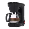 A black coffee maker with a glass carafe filled with coffee, set against a white background. Produktbild-Vorschau
