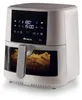A white Ariete air fryer filled with french fries, shown from a front-side angle against a white background. Náhled obrázku produktu