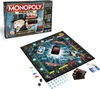 A Monopoly Banking Ultra board game set is displayed, including the game box and the game board with pieces. Produktbild-Vorschau
