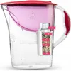 A clear, studio shot of a Dafi water filter pitcher with a pink upper reservoir and a red lid. The filter cartridge is visible inside, with numbered labels indicating different layers. Náhľad obrázku produktu