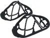 A pair of black shoe grips with metal coils for traction on ice or snow. Anteprima dell’immagine prodotto