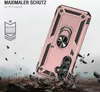 A rose gold phone case with a ring holder is shown in a dynamic, action-oriented scene, with debris falling around it, suggesting durability and protection. Produktbild-Vorschau