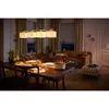 A dining room with a table set for a meal, a sofa, and a door. Anteprima dell’immagine prodotto