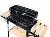 A charcoal grill with wooden side tables and shelves, shown against a white background. Produktbild-Vorschau