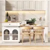 A modern kitchen island with a dining table extension, featuring chairs and kitchen appliances. Podgląd zdjęcia produktu