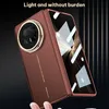 A folded smartphone case with a camera module and screen visible, presented against a dark, ribbed background. Produktbild-Vorschau