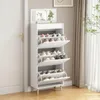 A white shoe cabinet with a mirror on top, placed next to a white door and in front of a window with curtains. Produktbild-Vorschau