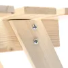A close-up view of wooden furniture construction, showing two screws fastening a diagonal support beam to a horizontal plank. Náhled obrázku produktu