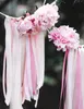 Pink peonies and ribbons hanging outdoors. Podgląd zdjęcia produktu