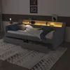 A modern daybed with integrated LED lighting and storage drawers, set in a bedroom environment. Produktbild-Vorschau