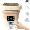 A portable washing machine with a digital display and a hand interacting with it, along with other product components shown separately. Produktbild-Vorschau