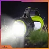 A powerful flashlight is shown in a natural outdoor setting, illuminating the grass and surrounding area with a bright beam of light. Podgląd zdjęcia produktu