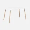 A white rectangular table with light wood legs against a white background. Anteprima dell’immagine prodotto