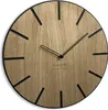 A close-up shot of a wooden wall clock with black hour markers and hands. Náhled obrázku produktu
