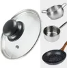 A collage of kitchenware, including a glass lid with a black handle, a small stainless steel pot, a saucepan, and a frying pan with a wooden handle. Náhled obrázku produktu