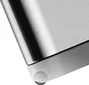 A close-up view of the bottom corner of a stainless steel trash can, showing a small wheel. Produktbild-Vorschau