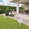 A garden path leading to a patio with outdoor furniture, lined with globe-shaped solar lights. Produktbild-Vorschau