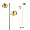 Two brass floor lamps with adjustable shades are shown against a white background. Produktbild-Vorschau